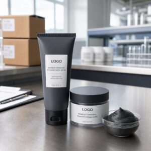 Private label bamboo charcoal foaming facial mask tube jar and foam texture on factory sample table