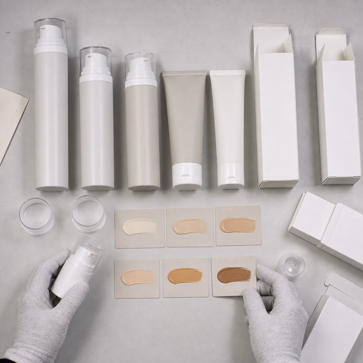 Airless pumps, squeeze tubes, blank cartons and six shade swatches for color-correcting cream packaging review